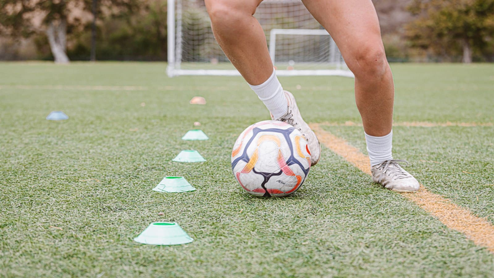 Dribbling through cones in training