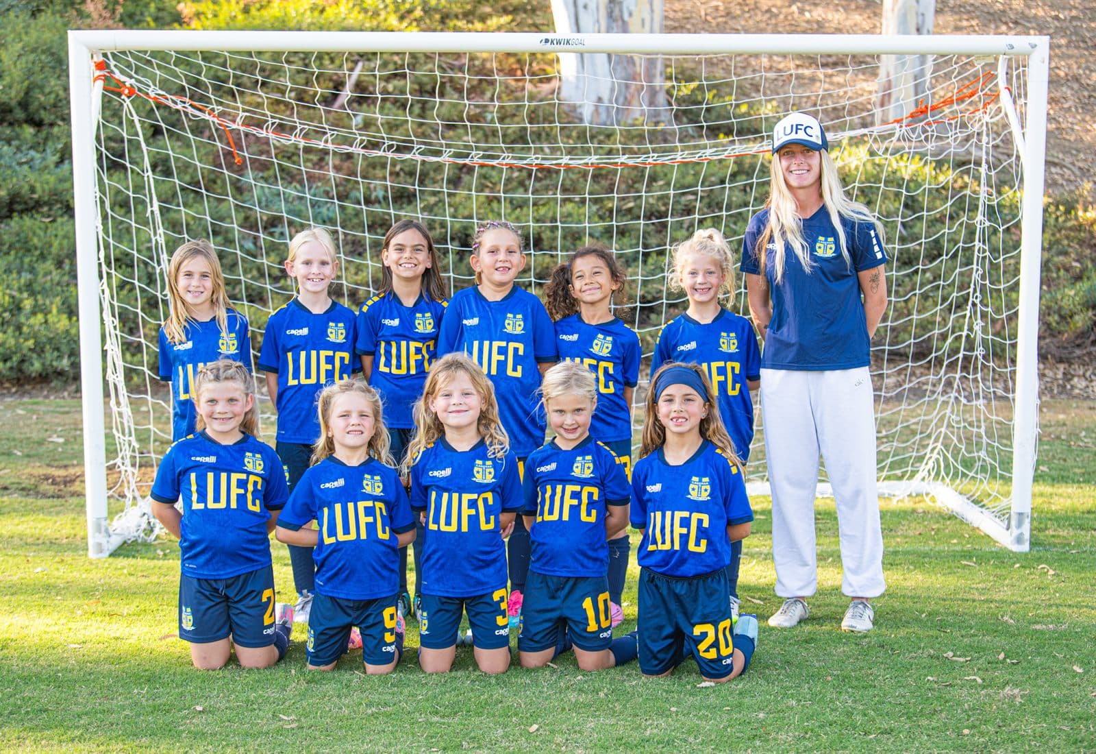 Coach Bella with one of her youth soccer teams